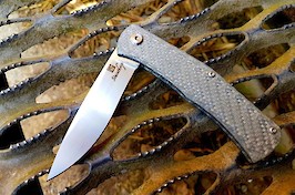 A more traditional slip-joint folder, made in silver twill G10 and ZDP-189 @Rc65