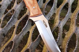 Convex ground trailing point hunter in 14C28N and Permali densified wood.