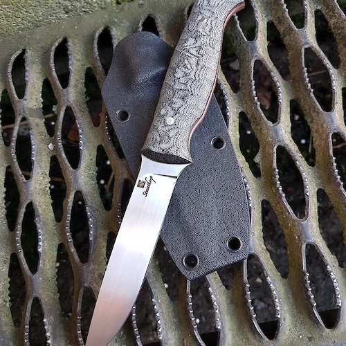 Slim and light drop-point hunter/utility knife in 14C28N and canvas micarta